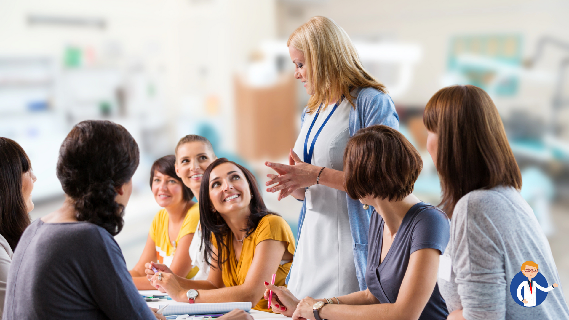A group of people are sitting around a table talking to each other.