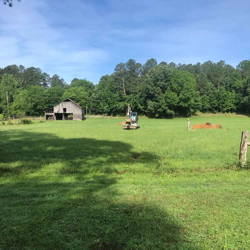 Excavator on A Field — Benton, AR — Emery Pump Service