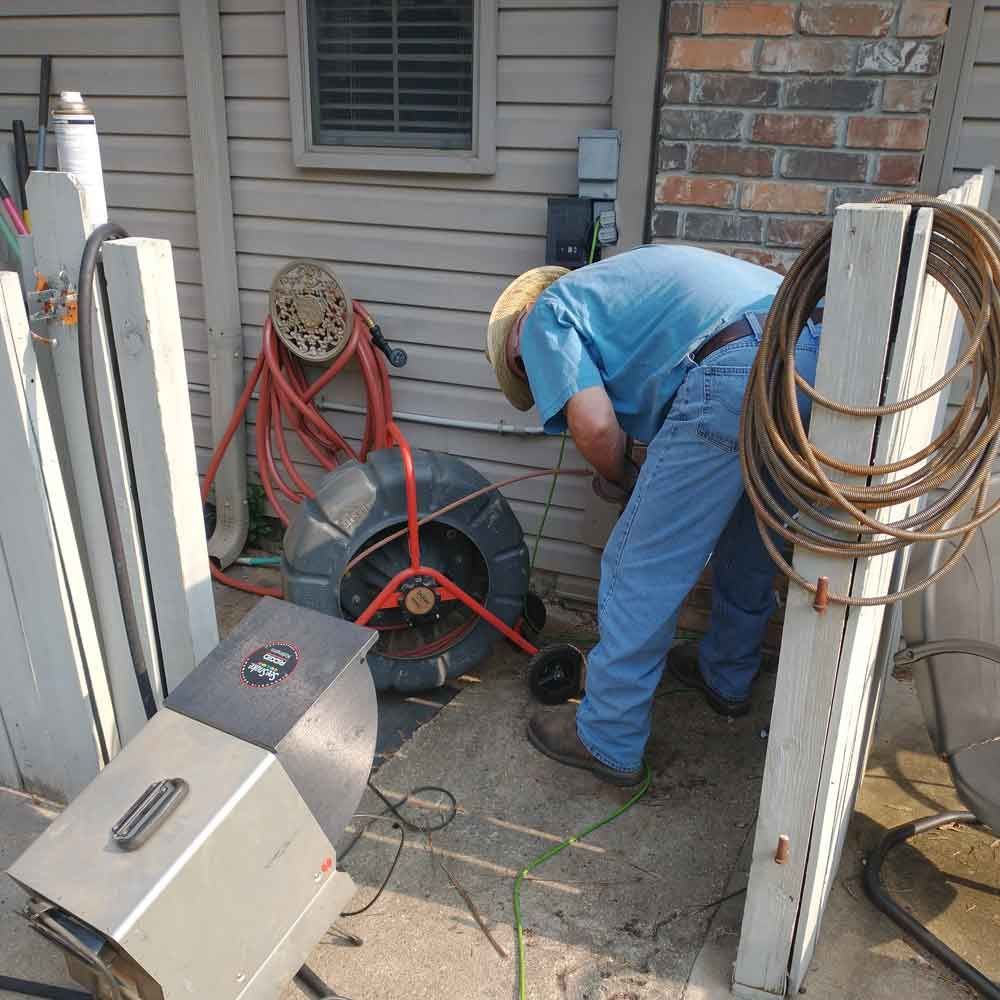 Man Doing Septic Inspection — Benton, AR — Emery Pump Service