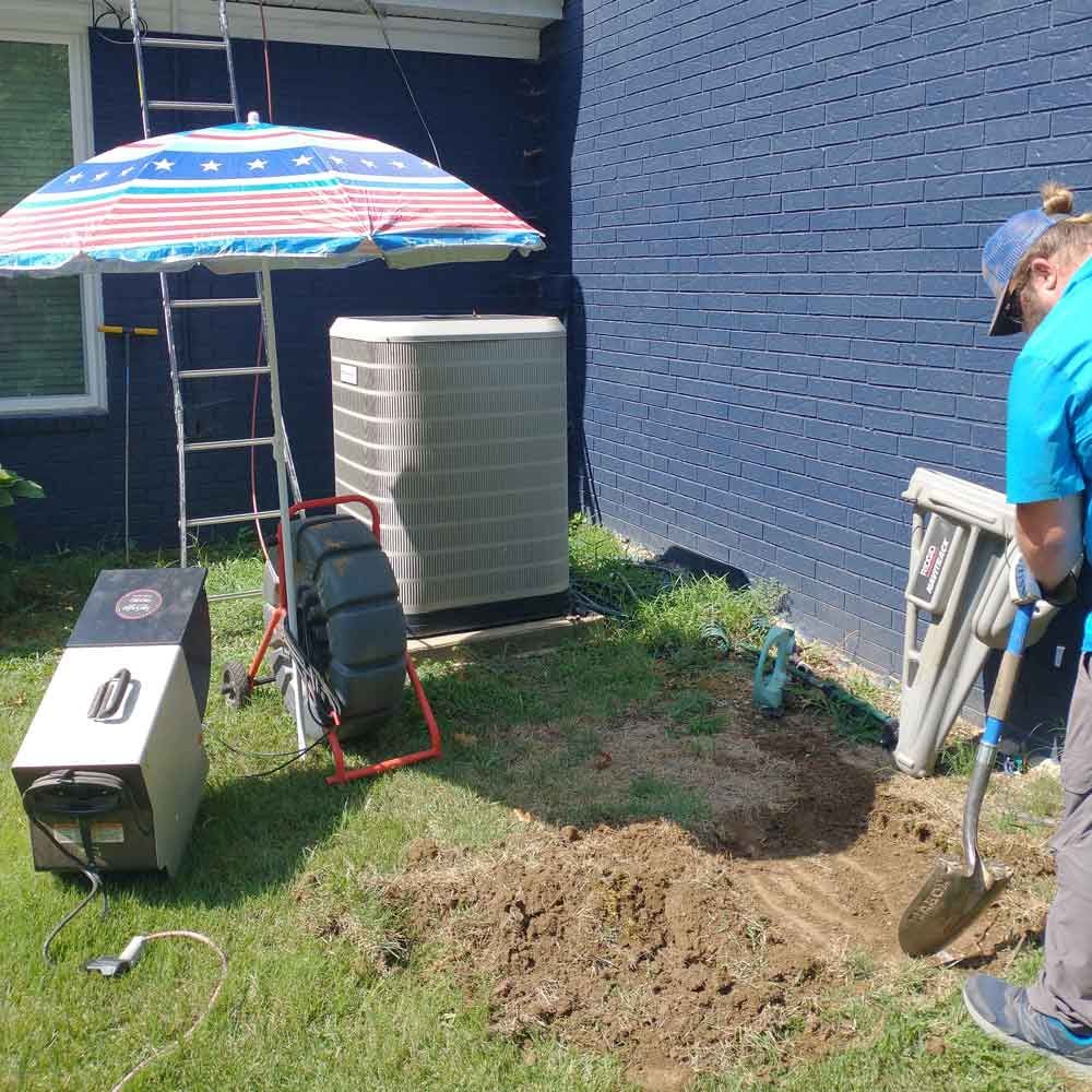 Man Digging Using a Shovel — Benton, AR — Emery Pump Service