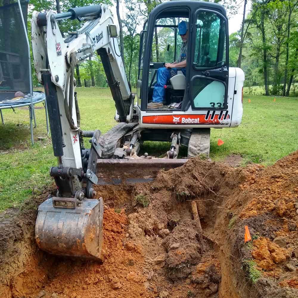 Excavator Digging the Ground — Benton, AR — Emery Pump Service