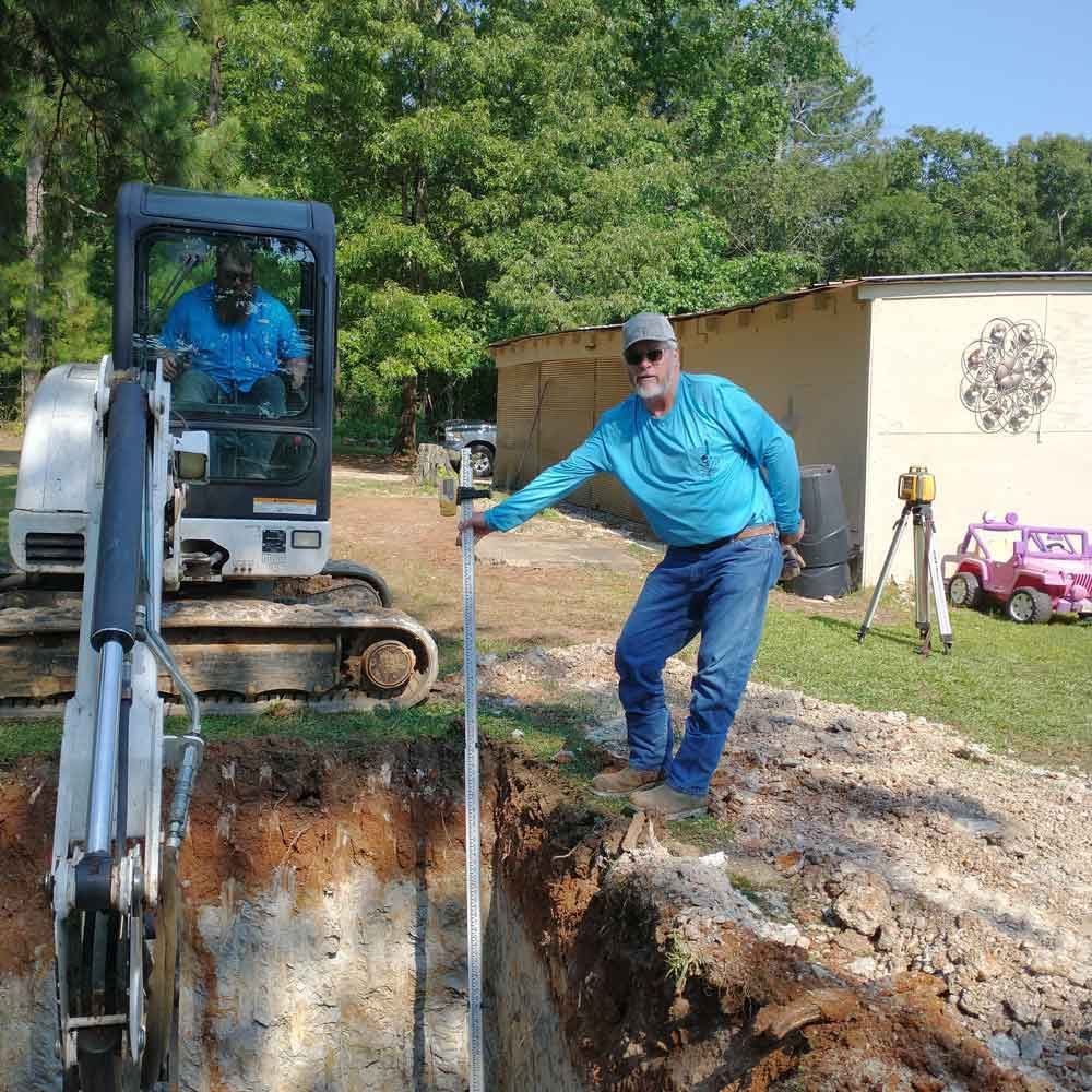 Man Holding a Measurement Tool — Benton, AR — Emery Pump Service