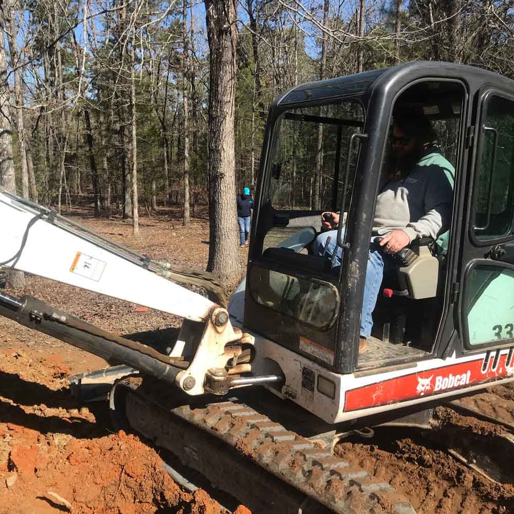 Man Using an Excavator — Benton, AR — Emery Pump Service