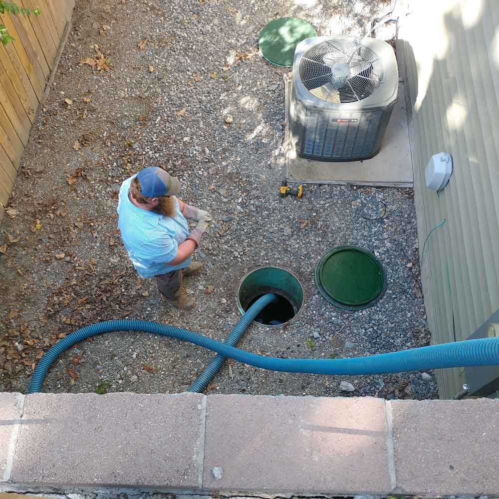 Man Pumping a Septic Tank — Benton, AR — Emery Pump Service