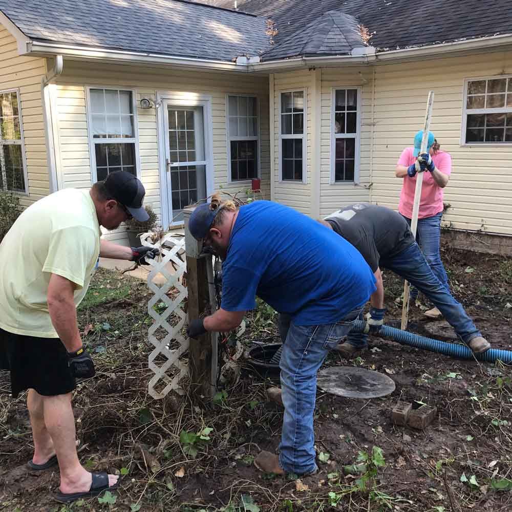 Cleaning Backyard While Pumping Septic Tank — Benton, AR — Emery Pump Service