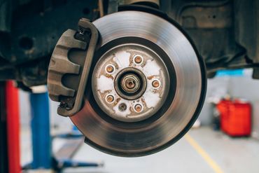 Close up of car disc brake during the wheel tire change or repair.