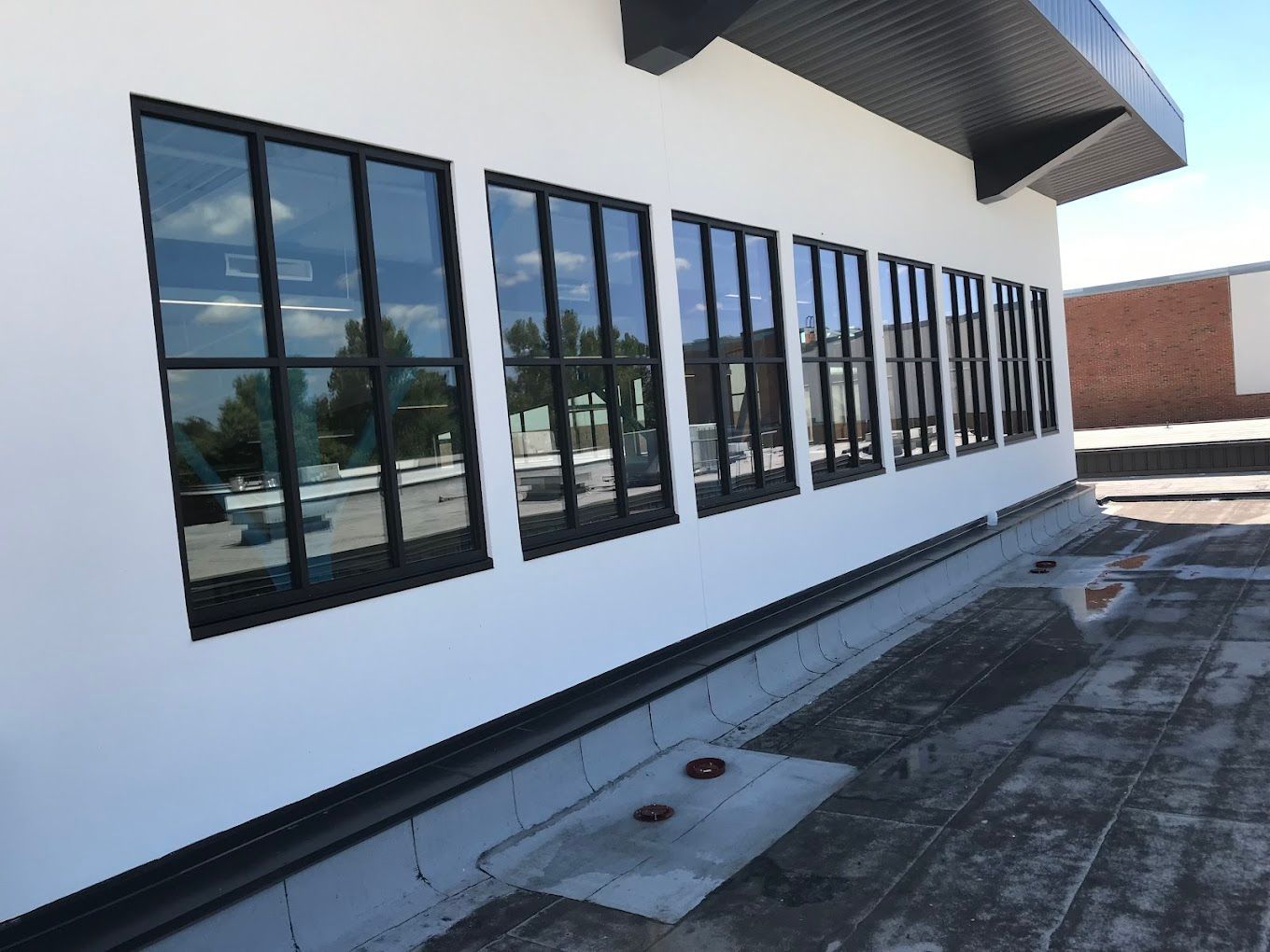 A white building with a lot of windows on it