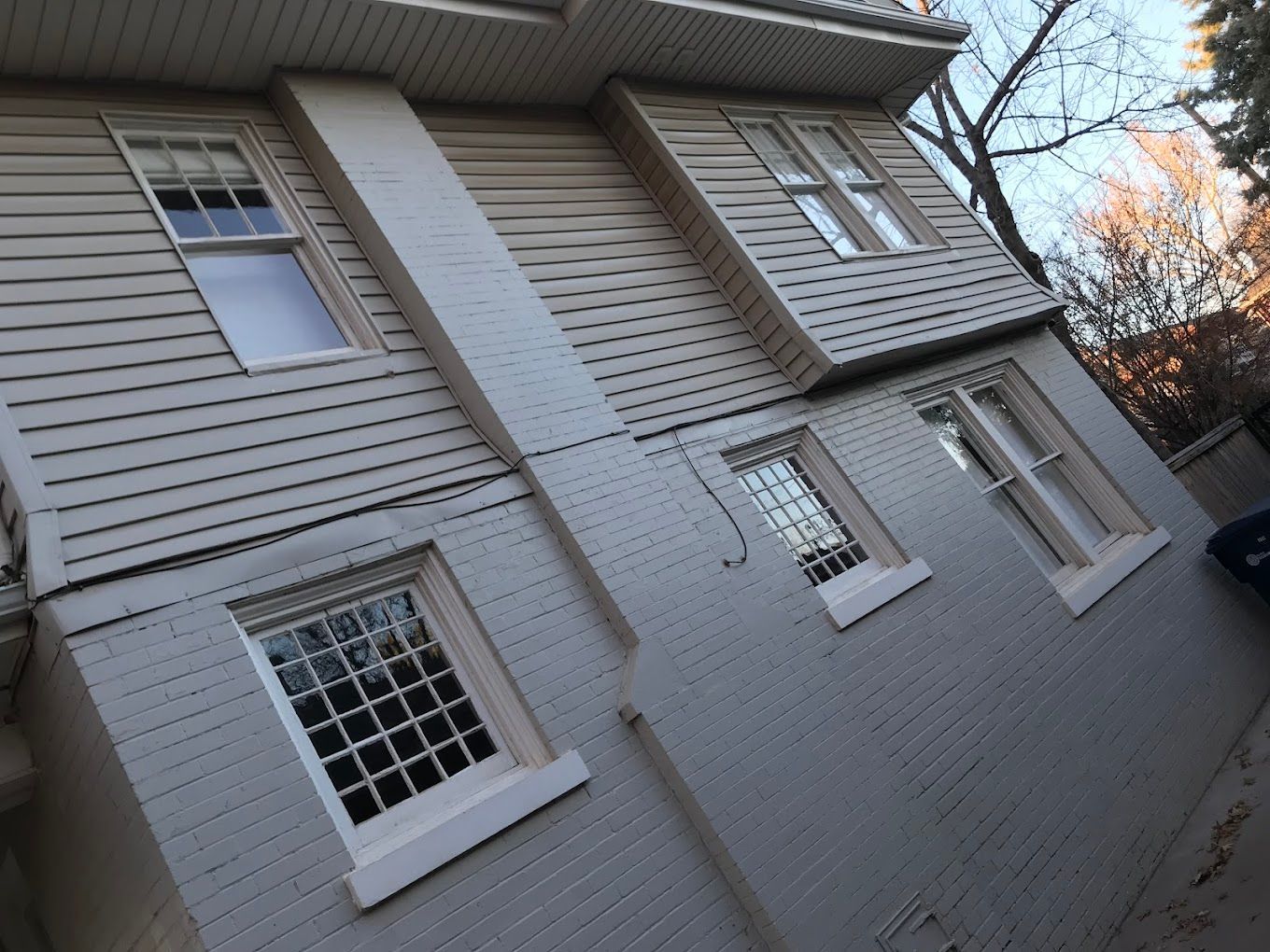 A white house with a lot of windows on it