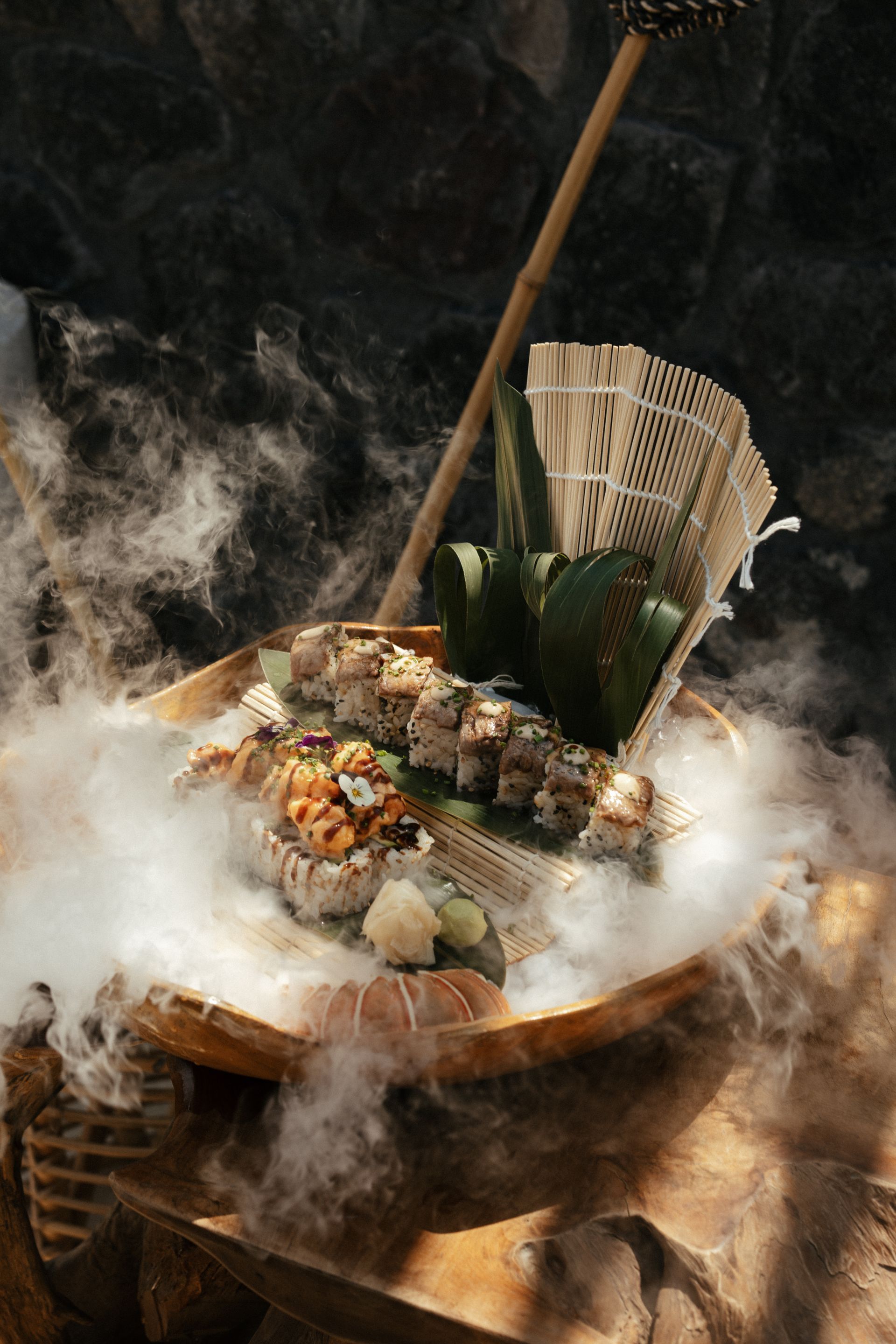 A bowl of food with smoke coming out of it on a table.