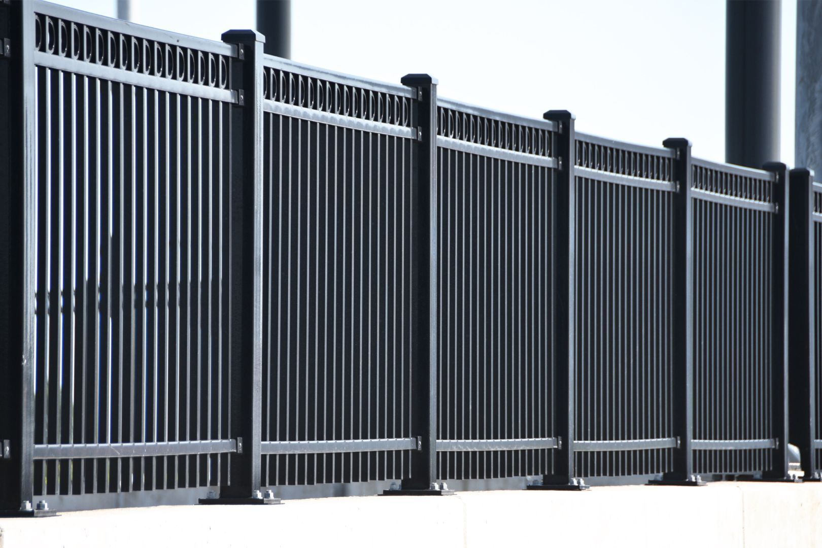 an image of a black metal fence surrounding a parking lot in Kent, OH