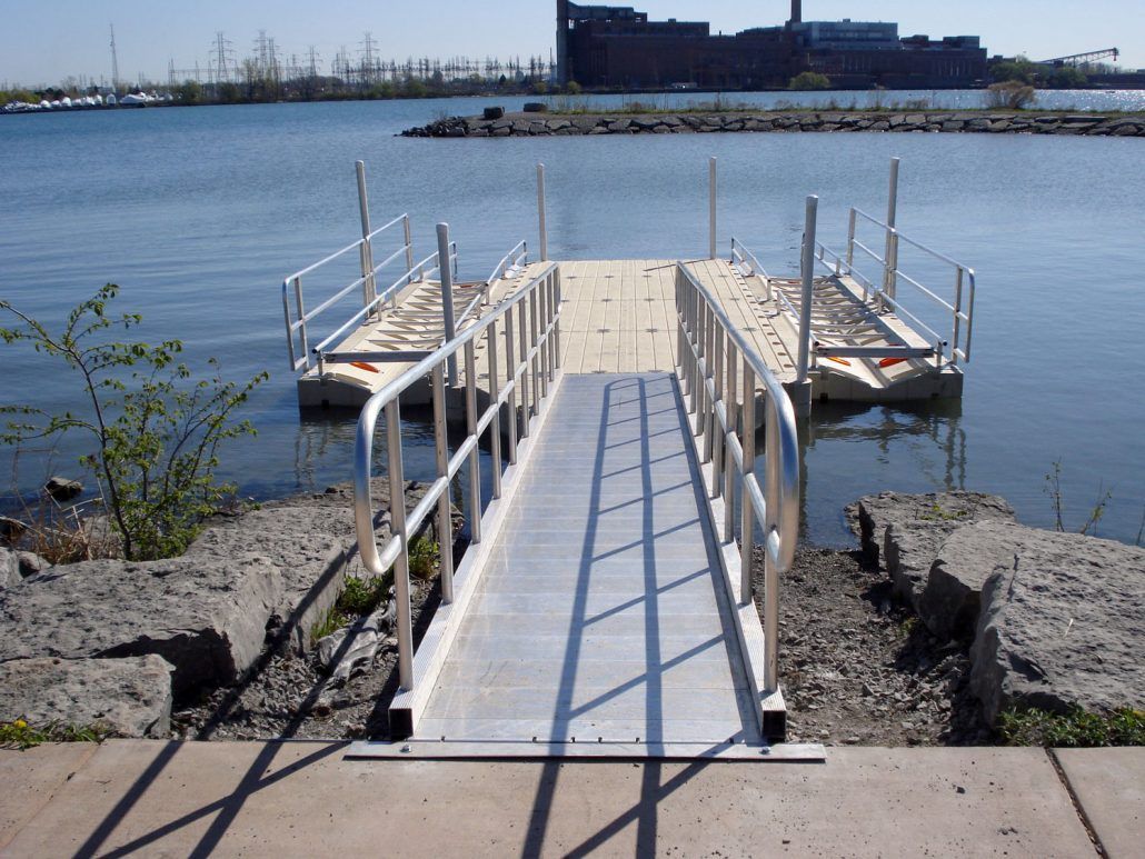 A dock with a ramp leading to the water