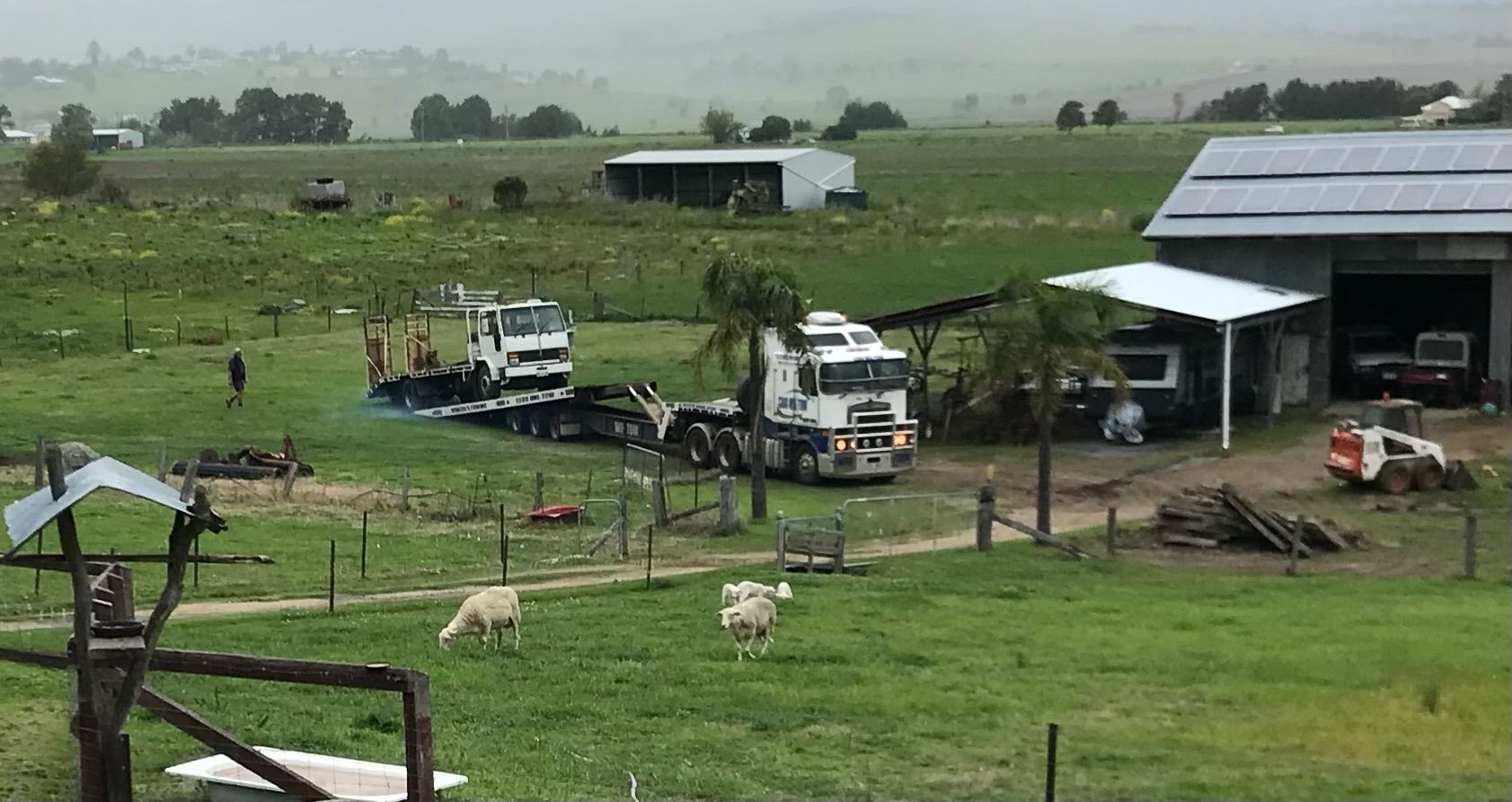 Two Tow Trucks In A Field — Wilson's Towing In North Toowoomba, QLD