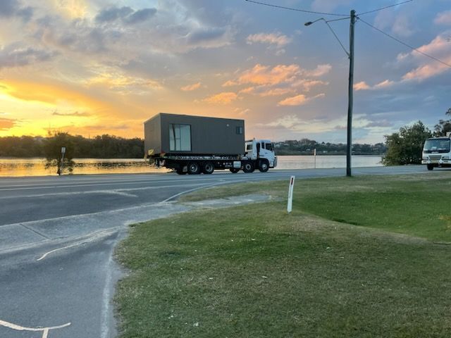 Tow Truck Towing a Container— Wilson's Towing In North Toowoomba, QLD
