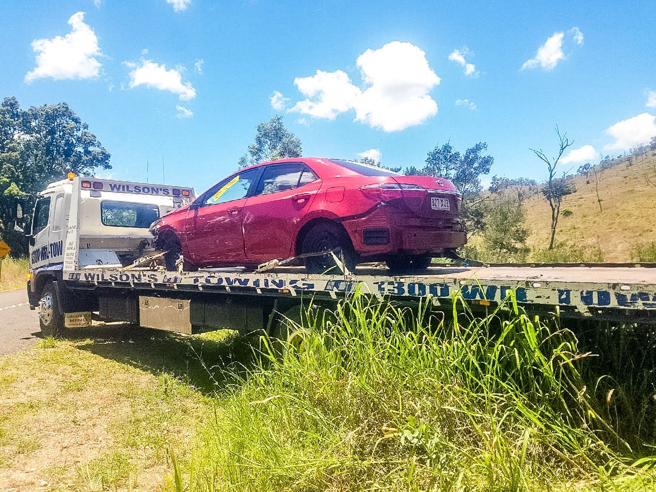 Black Truck With a Broken Windshield is Parked on the Side of the Road — Wilson's Towing In North Toowoomba, QLD