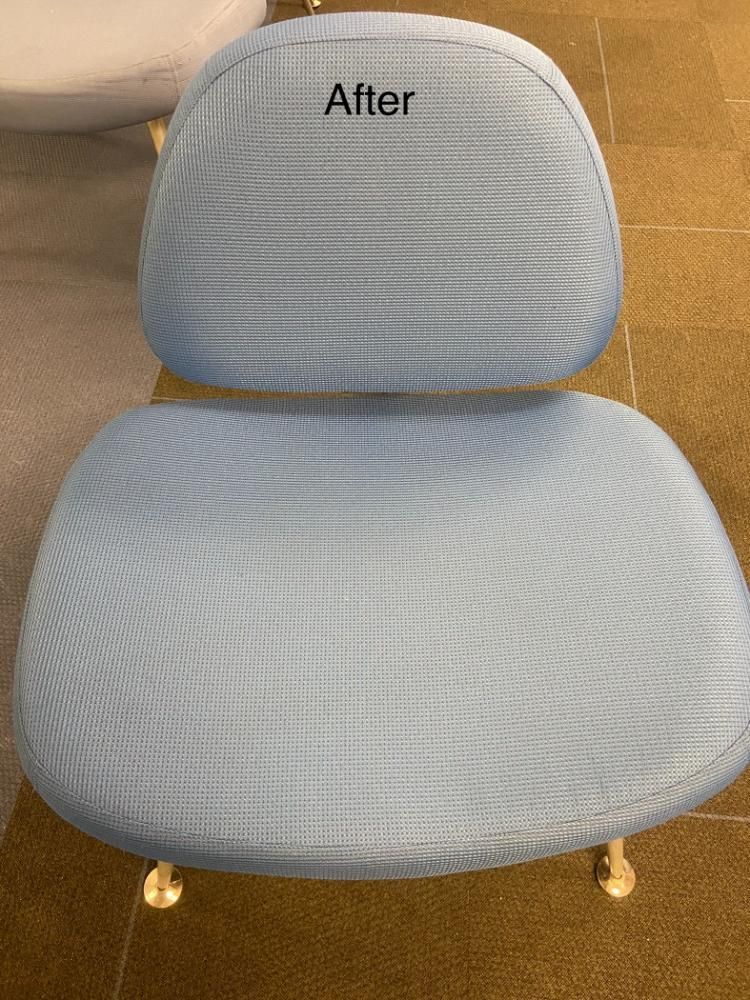 A light blue chair with the word after written on it.