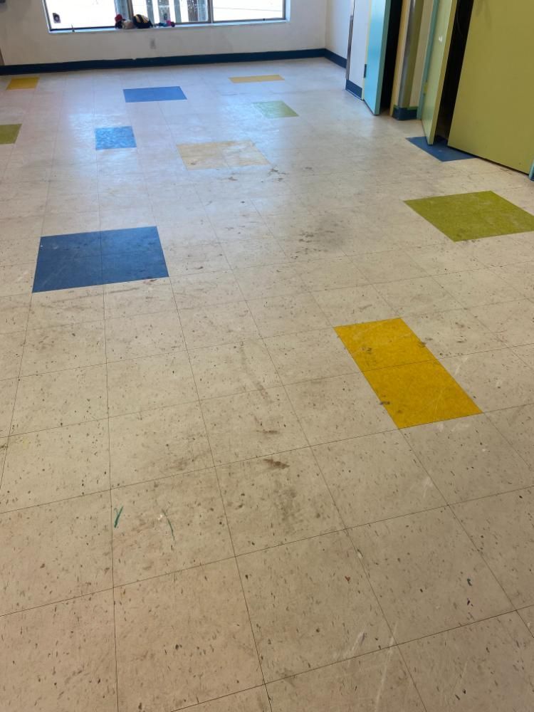 A tiled floor with blue and yellow squares on it