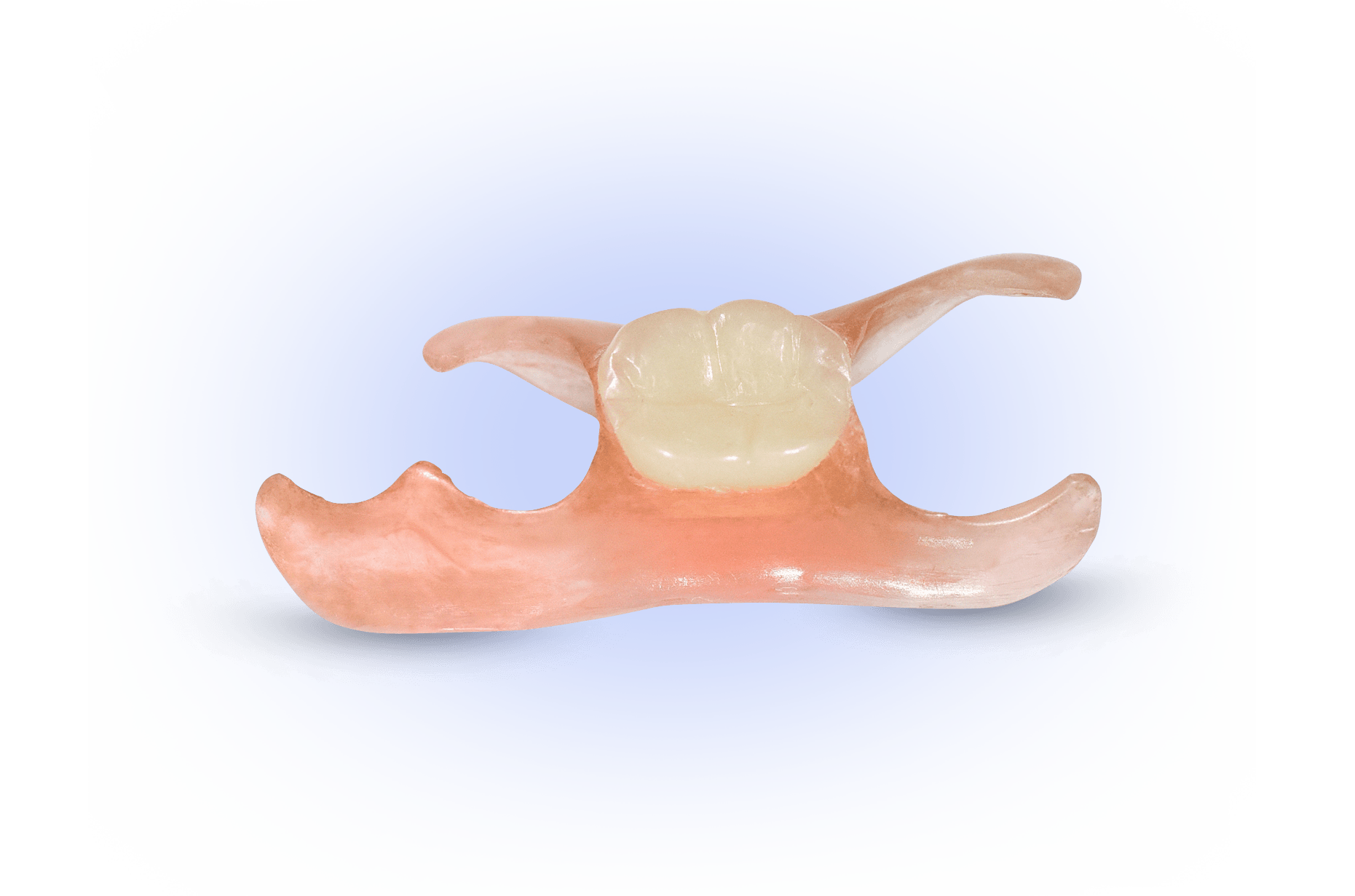 A close up of a denture with a tooth on it