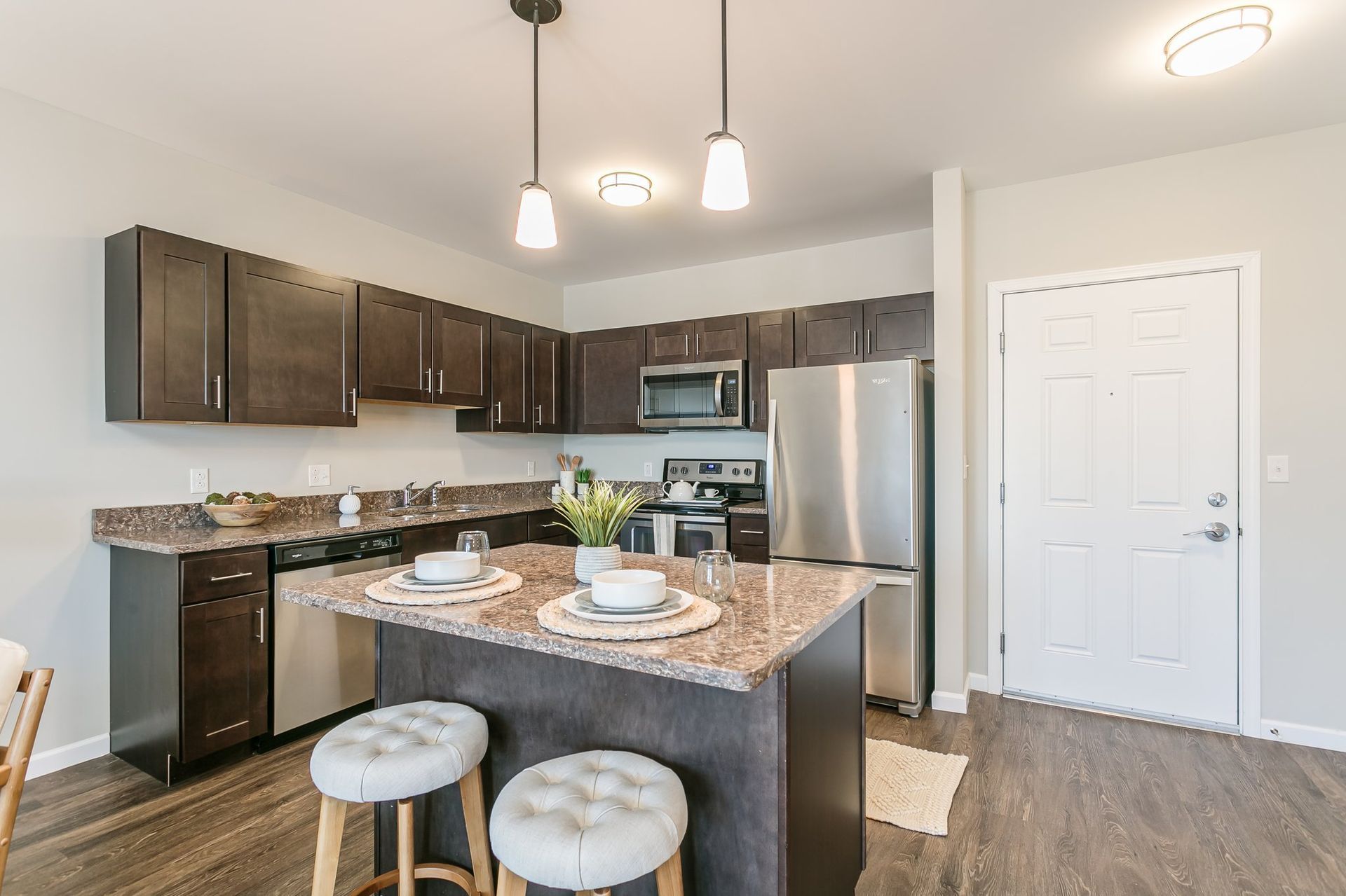 Kitchen with island and stainless steel appliances