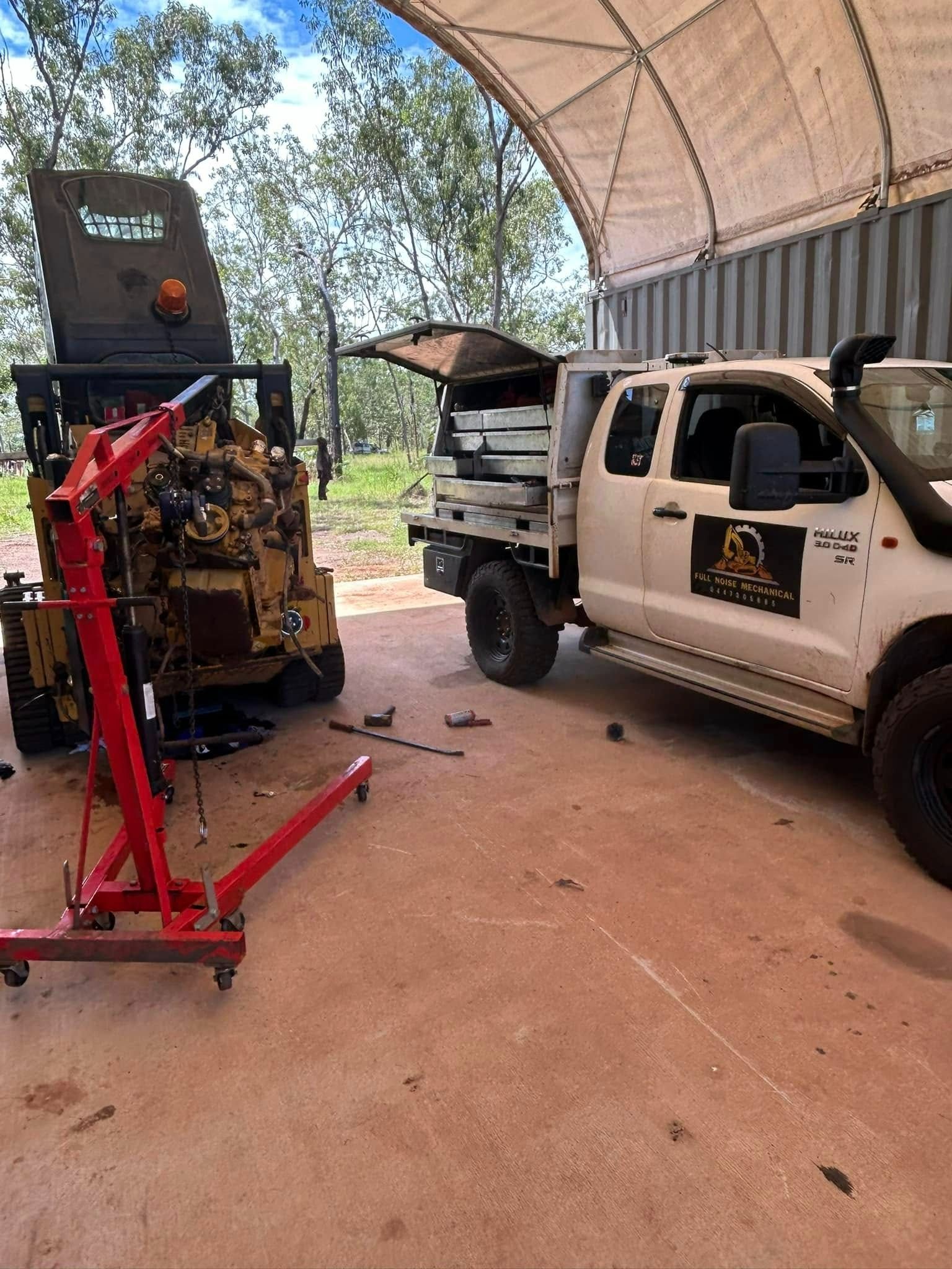 Yellow Construction Equipment Next to a White Pickup Truck — Full Noise Mechanical in Humpty Doo, NT