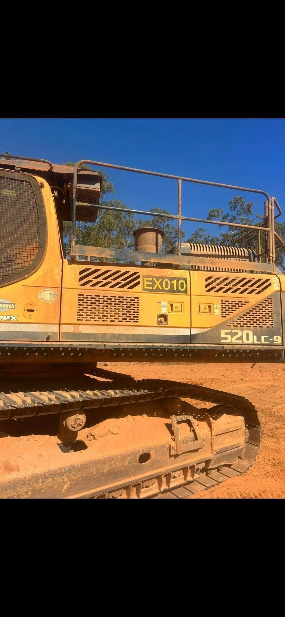 Yellow Excavator on a Dirt Surface Under a Blue Sky — Full Noise Mechanical in Humpty Doo, NT