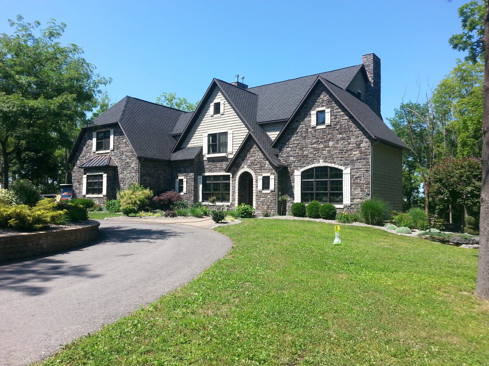 A large house with a driveway leading to it