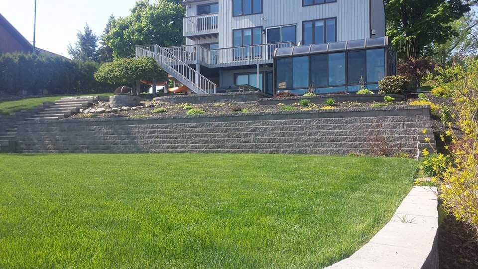 A large house with a large lawn in front of it