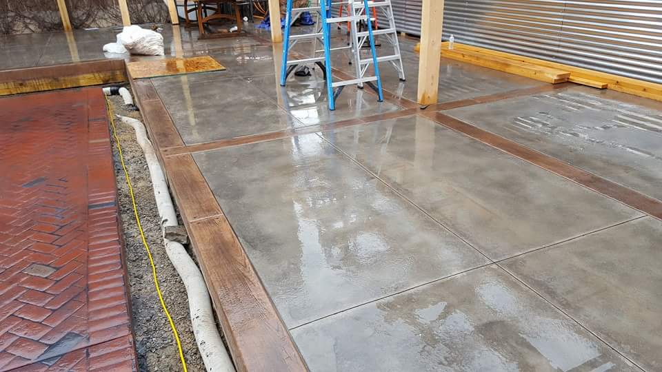 A ladder is sitting on top of a concrete floor.