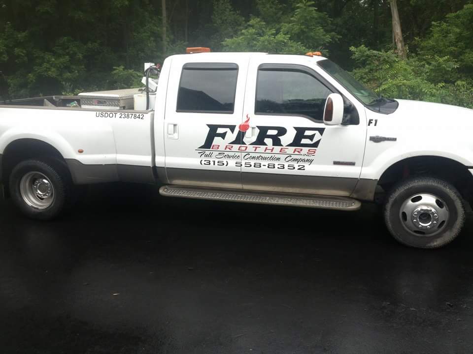 A white truck with the word fire on the side