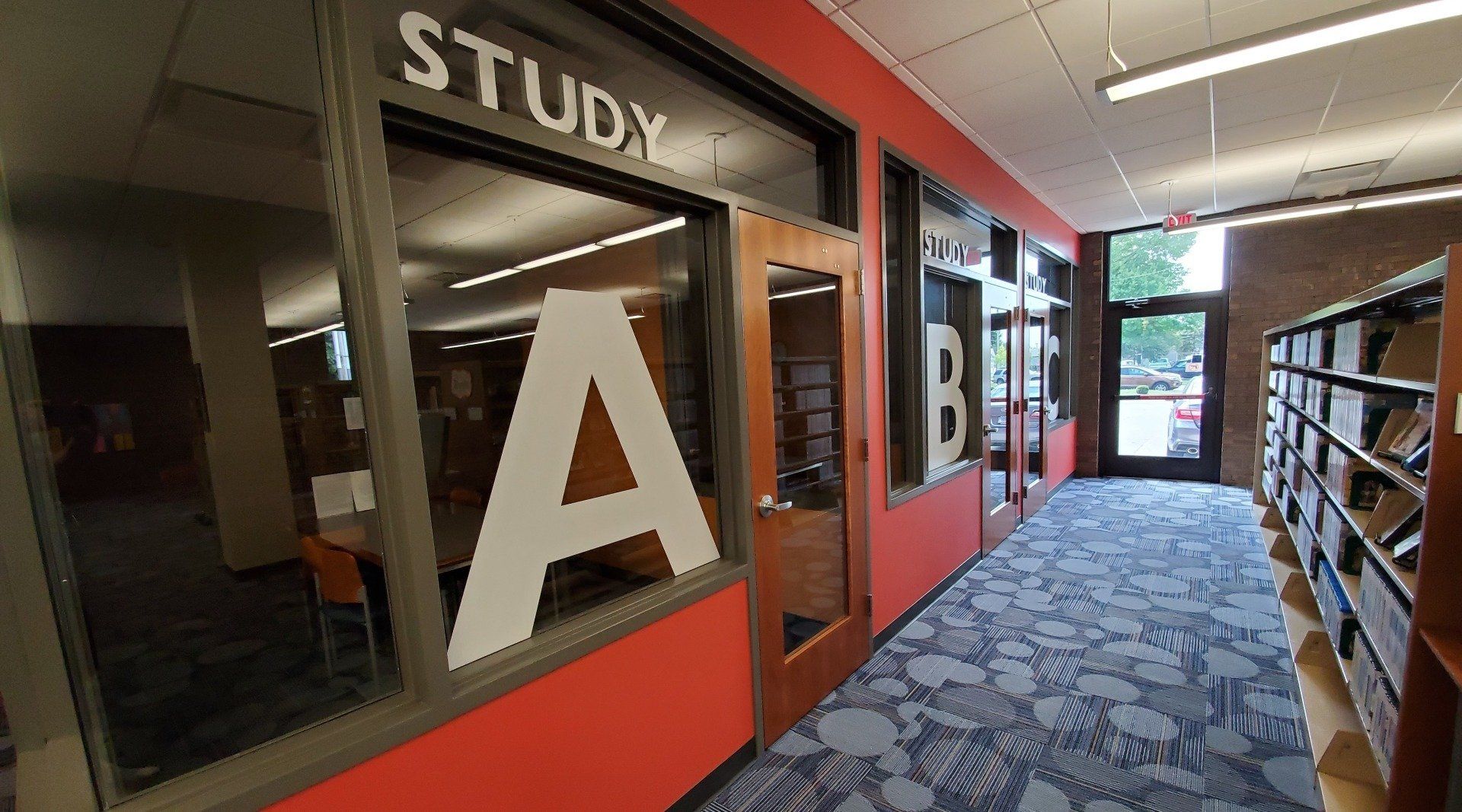 A hallway with a sign that says study a on it