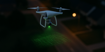 Drone 3D mapping street intersection of road below.
