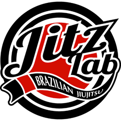 The jiu jitsu lab logo is black and red with a red ribbon.