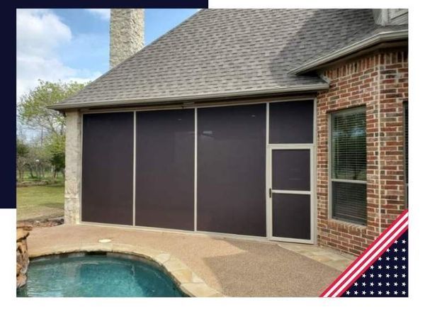 Screened-in patio with brown screens and a matching door. The patio is next to a pool and brick home.