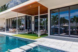 Glass Sliding Doors — Glass Doors and Windows Beside the Pool in Deerfield Beach, FL