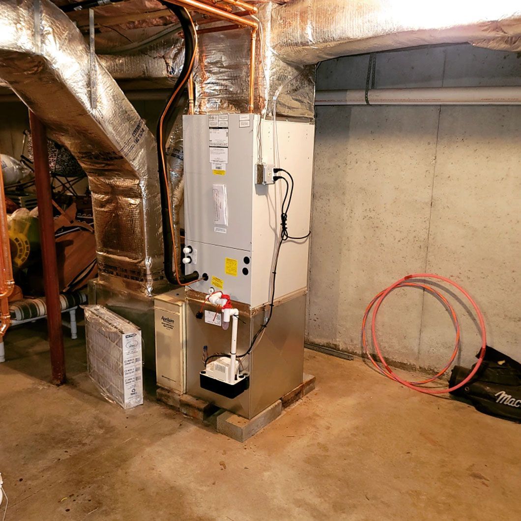 There is a heater in the corner of the room.