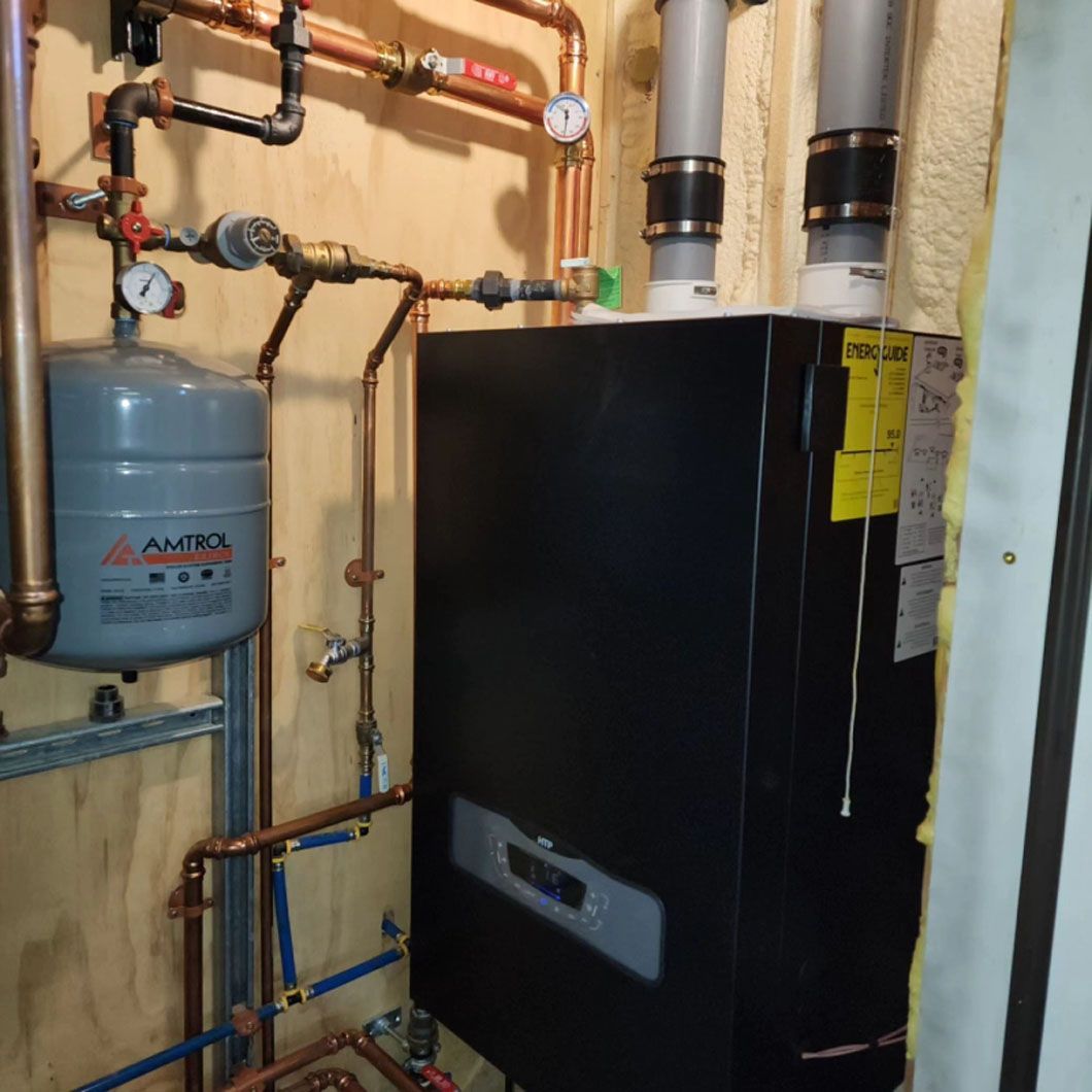 A boiler with a yellow warning sign on it