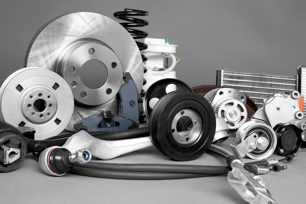 A Collection of Various Car Parts, Including Brake Rotors, Pulleys — JNL Crankshaft Services in Palmerston City, NT