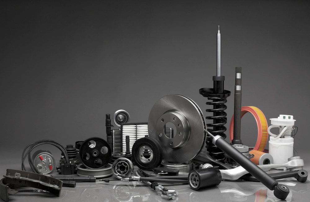 A Collection of Various Automotive Spare Parts, Including a Brake Rotor — JNL Crankshaft Services in Palmerston City, NT