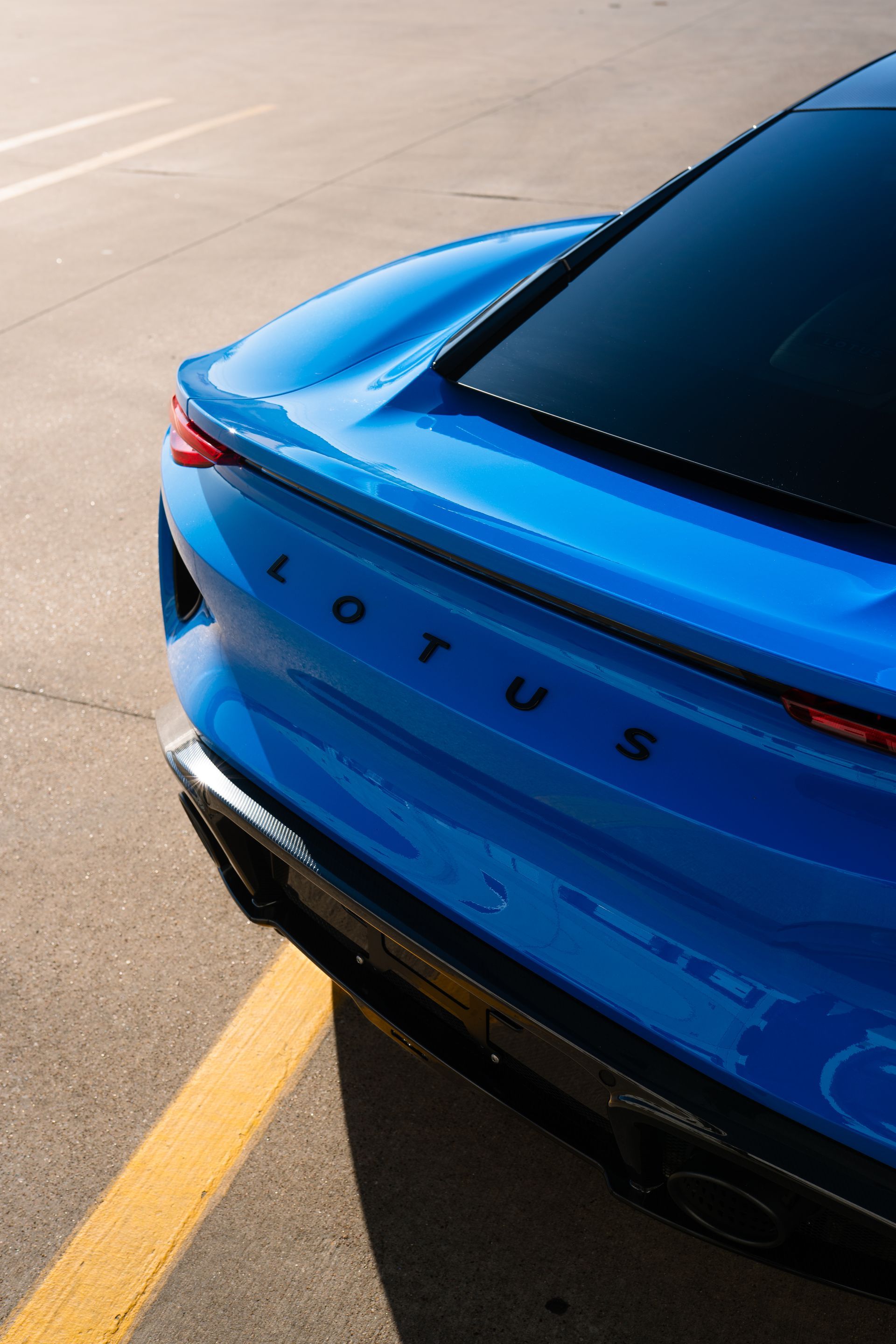 A close up of a blue car 's side mirror