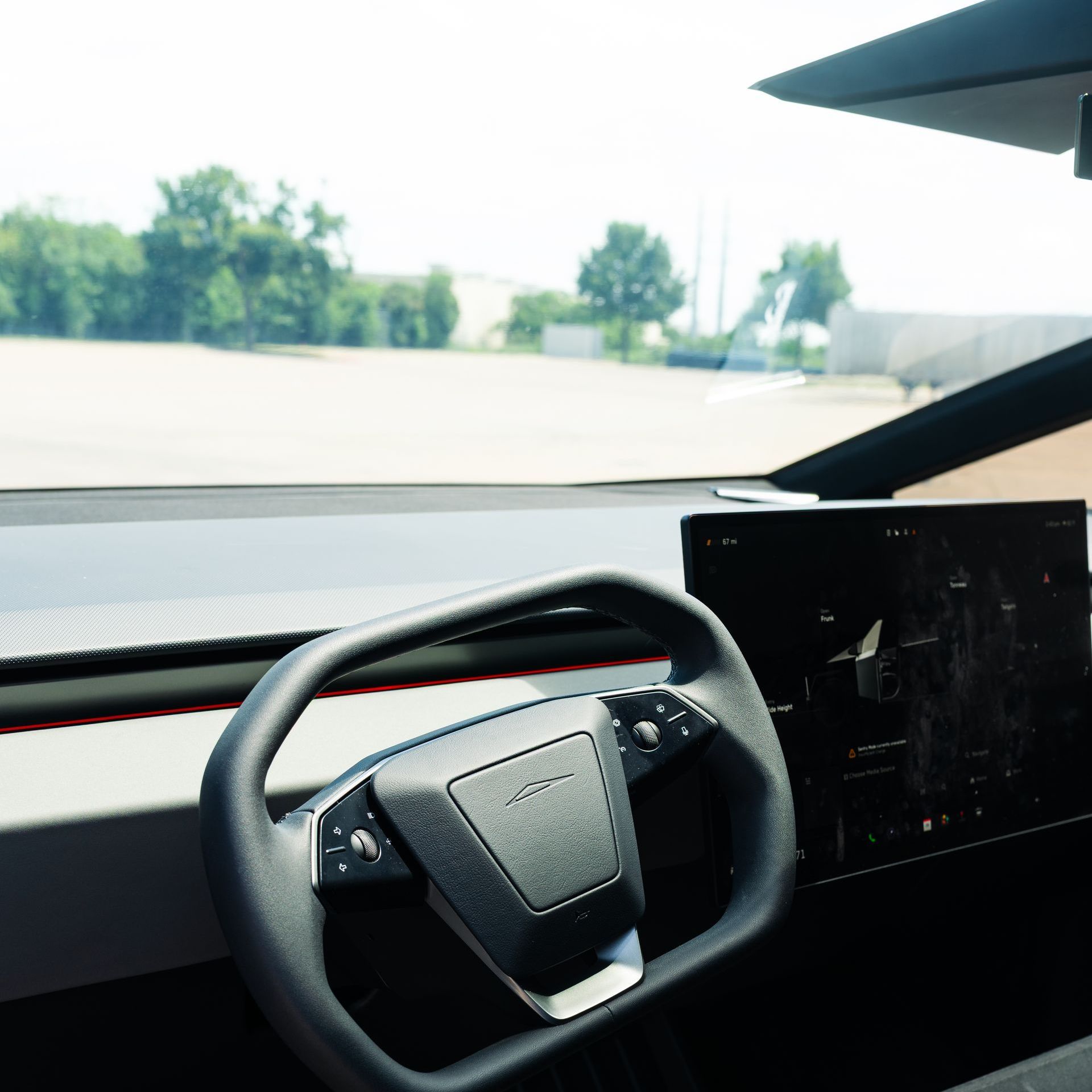 A close up of a steering wheel in a car.