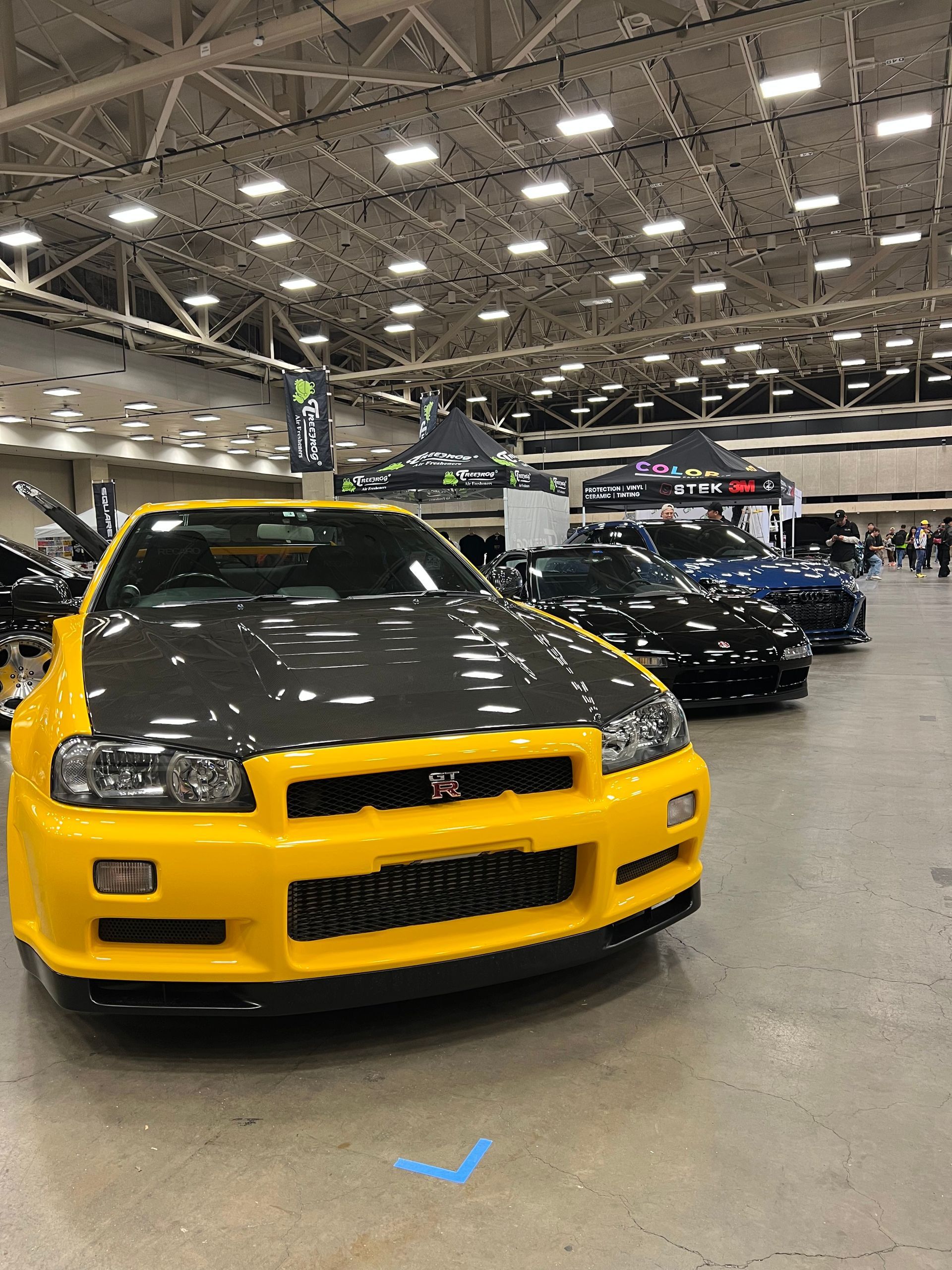 Yellow car with Paint Protection Film on a car show