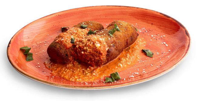 Fried eggplant rollatini on red plate with sauce and garnish.