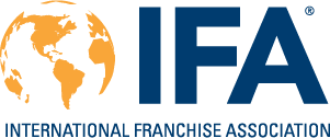 Logo of the International Franchise Association, featuring a stylized orange globe and blue text.