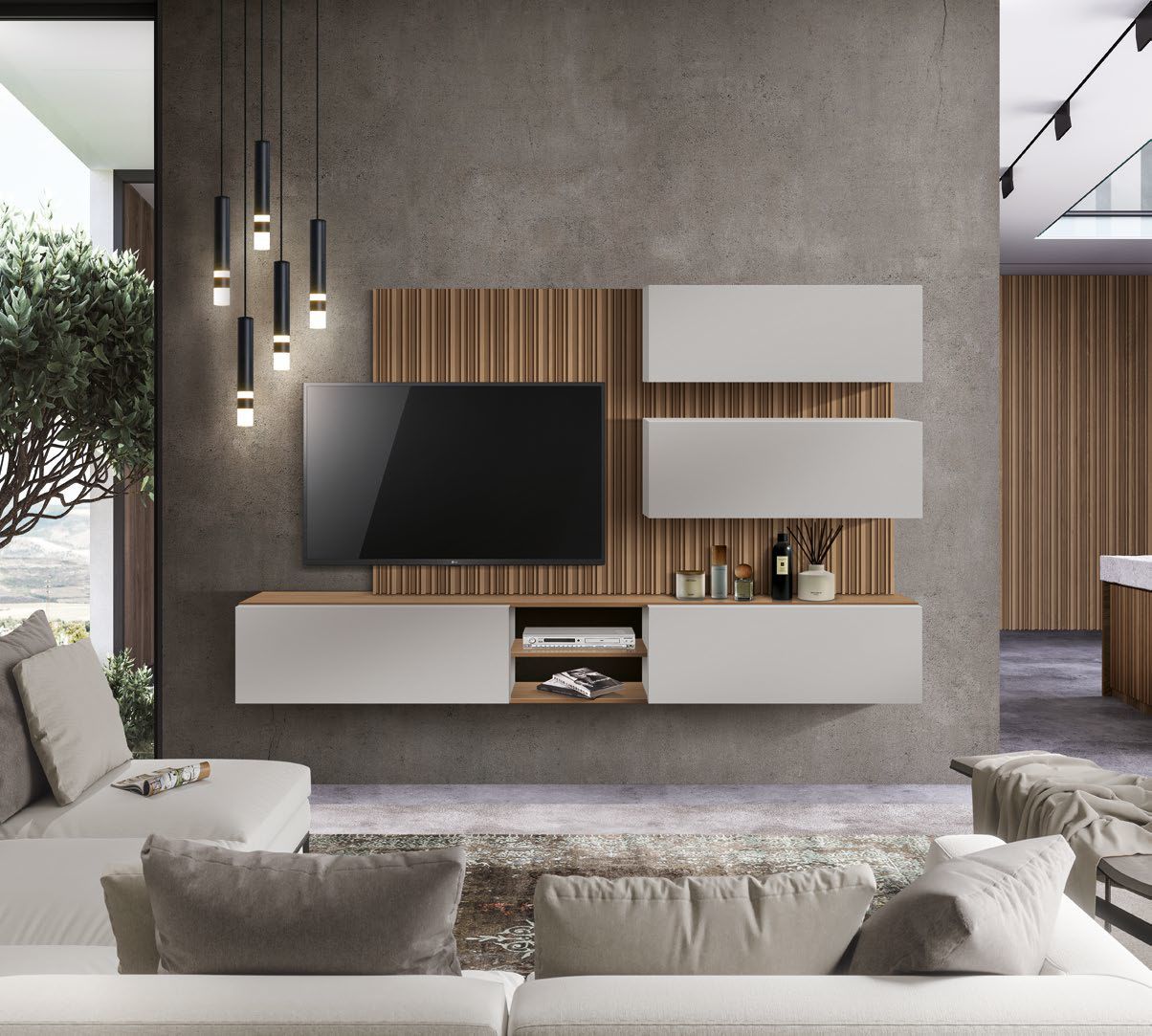 Un soggiorno con un divano e un televisore a parete