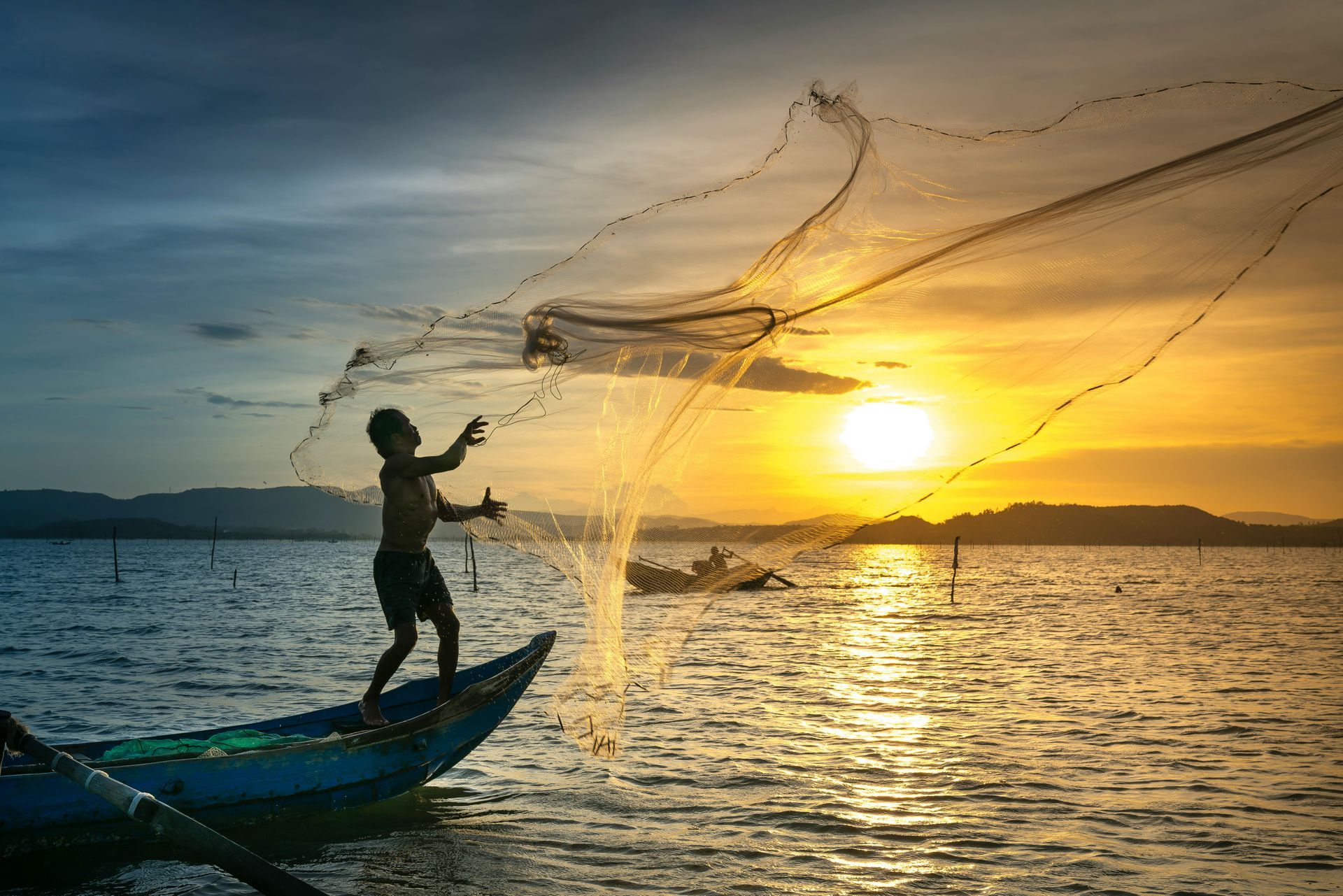 Man casting fishing net