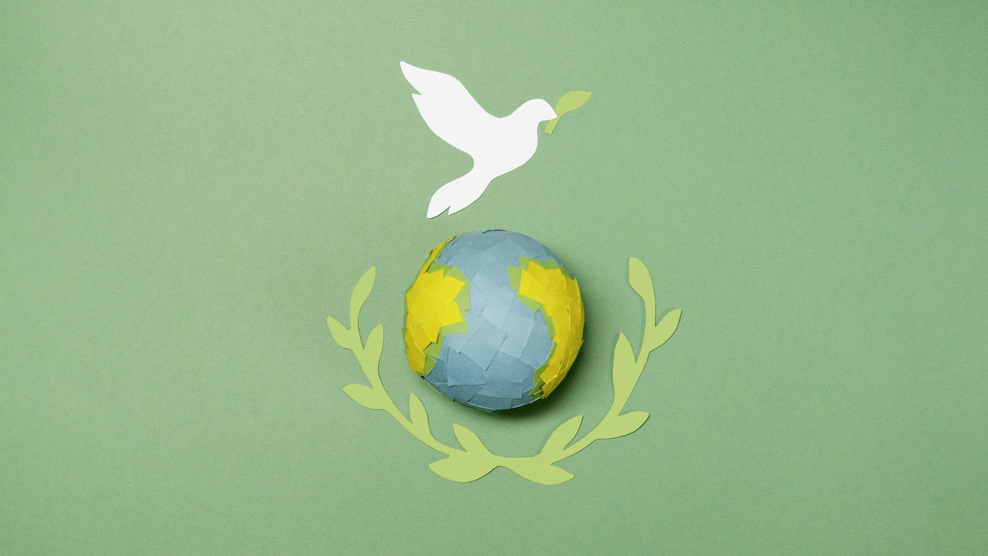 dove flying over globe