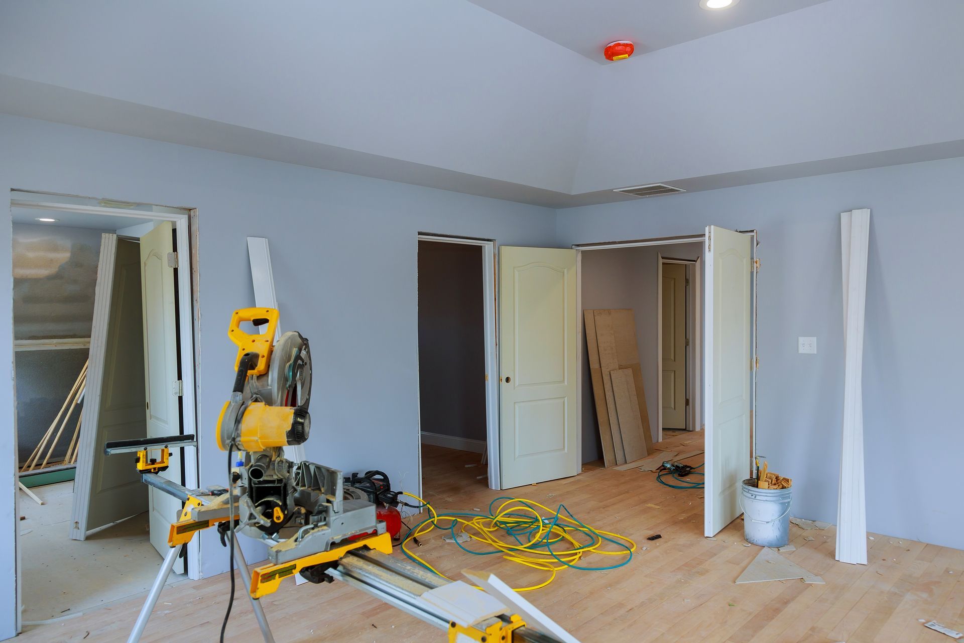 A room is being remodeled with a circular saw in the middle of the room.