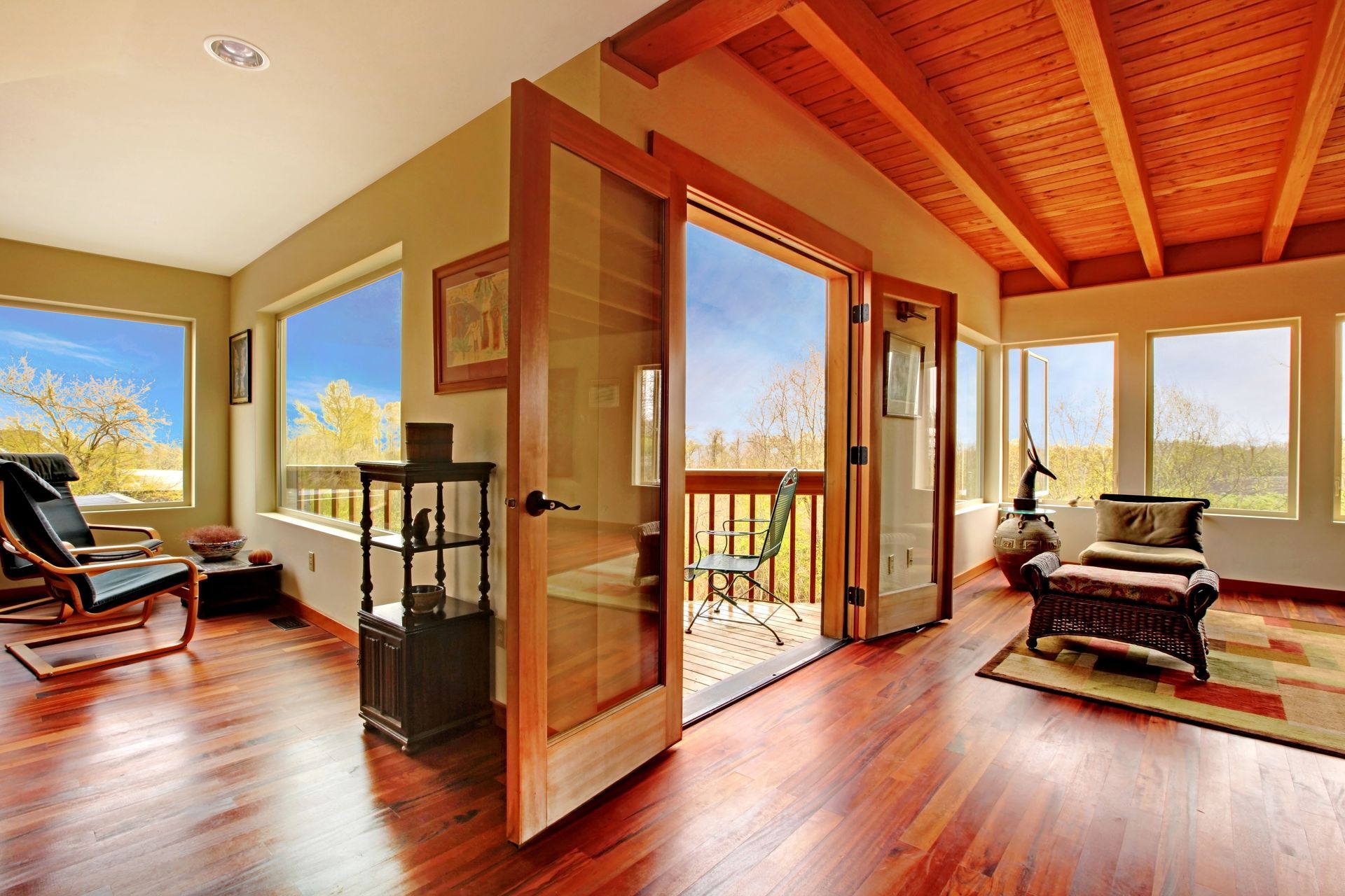 A living room with hardwood floors and sliding glass doors
