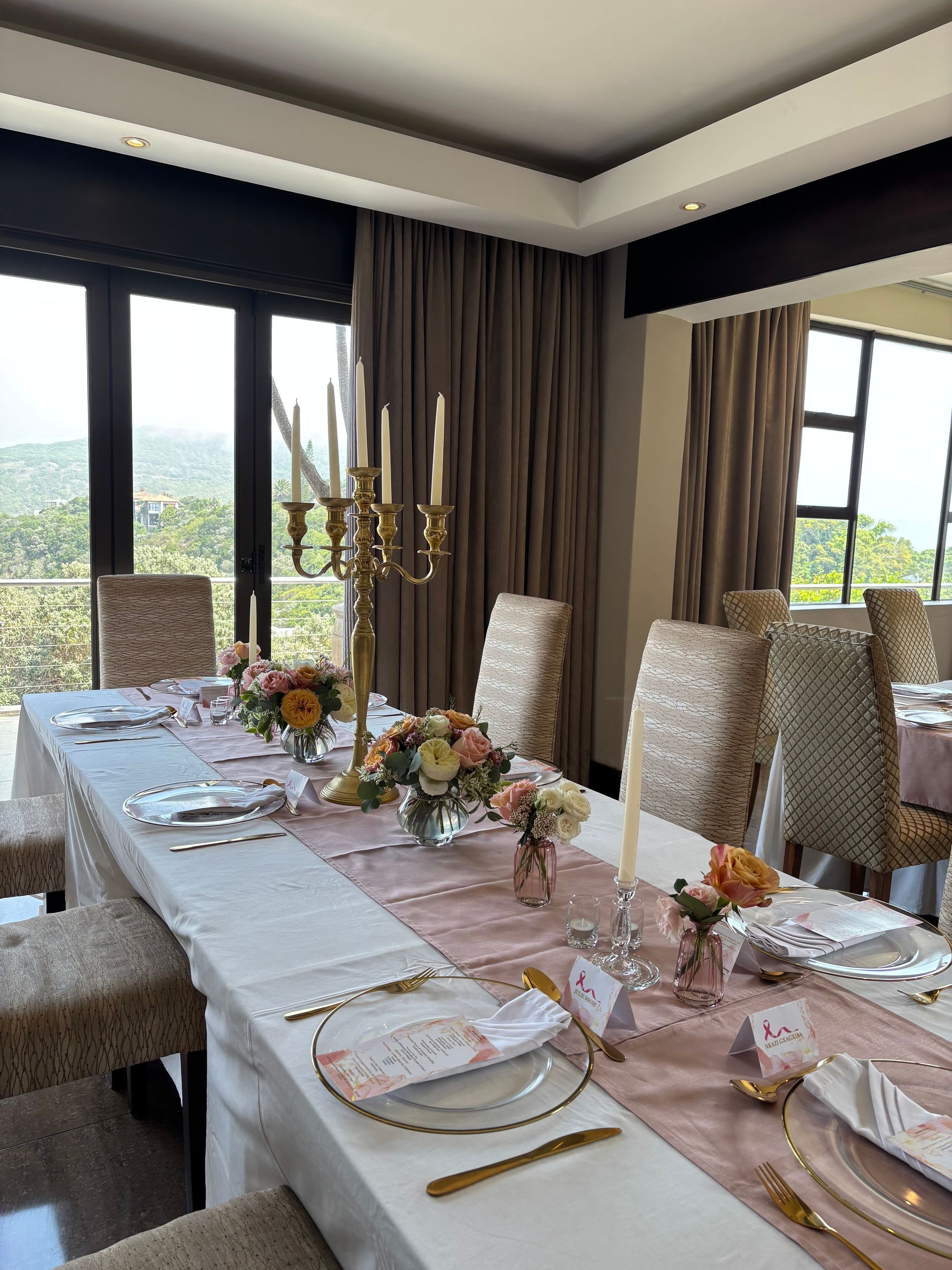 Eggs Benedict with smoked salmon, hollandaise sauce, and microgreens on a white plate.