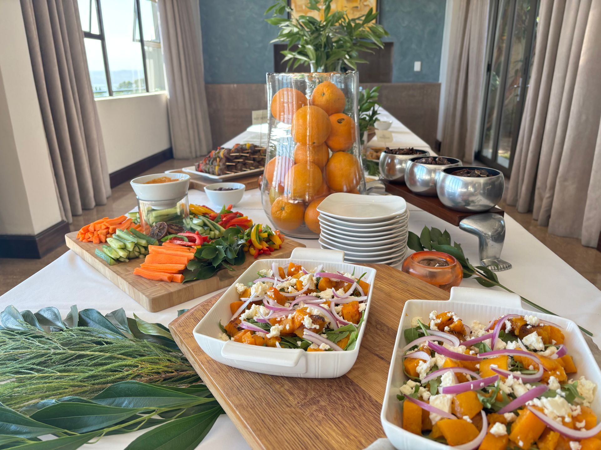 Two whales in dark turquoise ocean; one gray, the other dark.