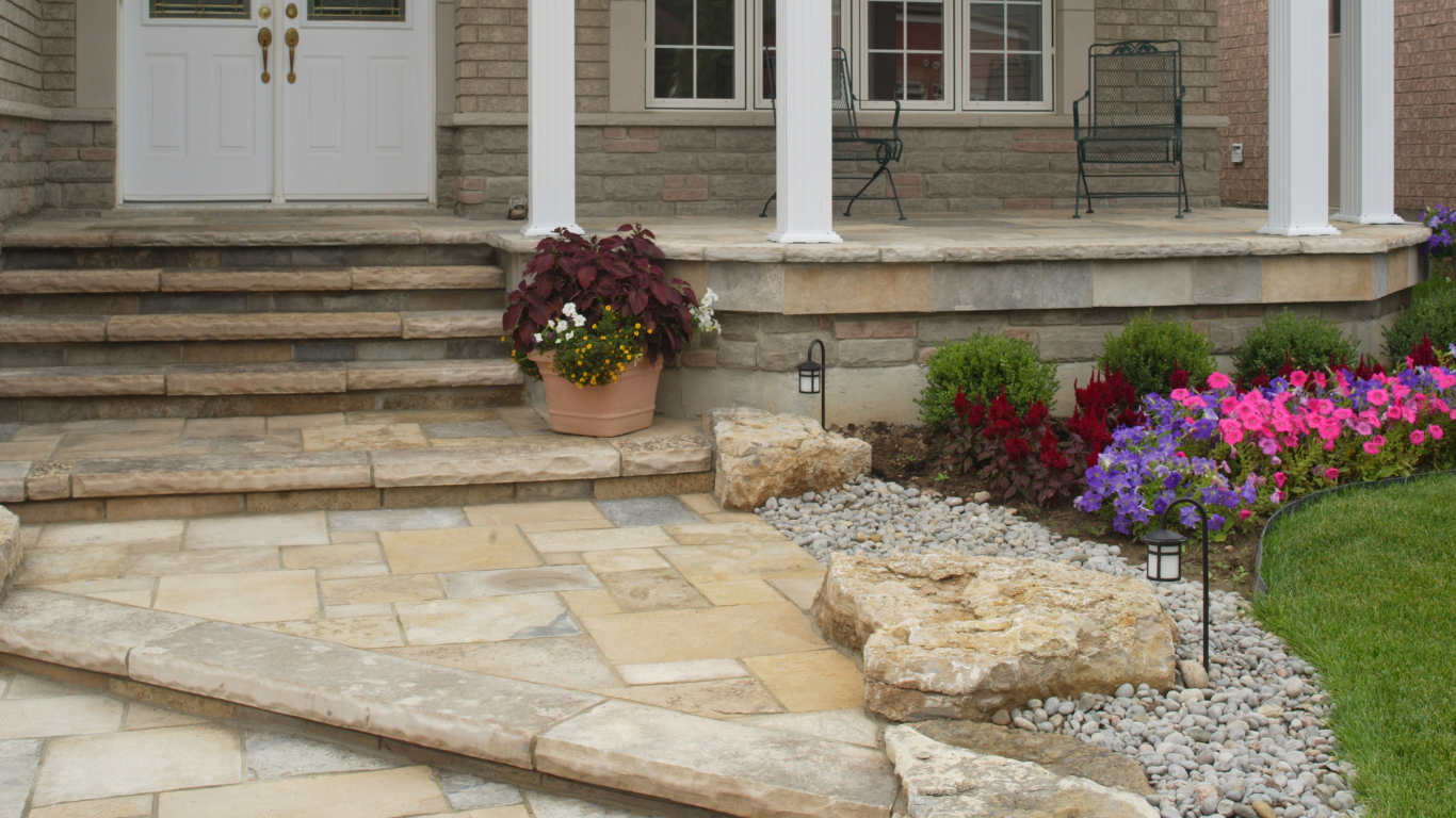 A stone walkway leading to the front door of a house.